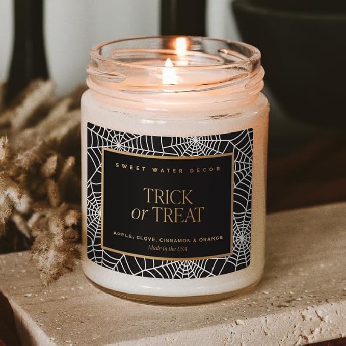 Sweet Water Decor Trick or Treat Candle, Autumn Scented Notes of Pumpkin, Spices, & Caramel, 40+ Hour Burn Time, Non-Toxic Soy Wax Blend, Poured in The USA, Cotton Wick, 9oz Glass Jar with Gold Lid